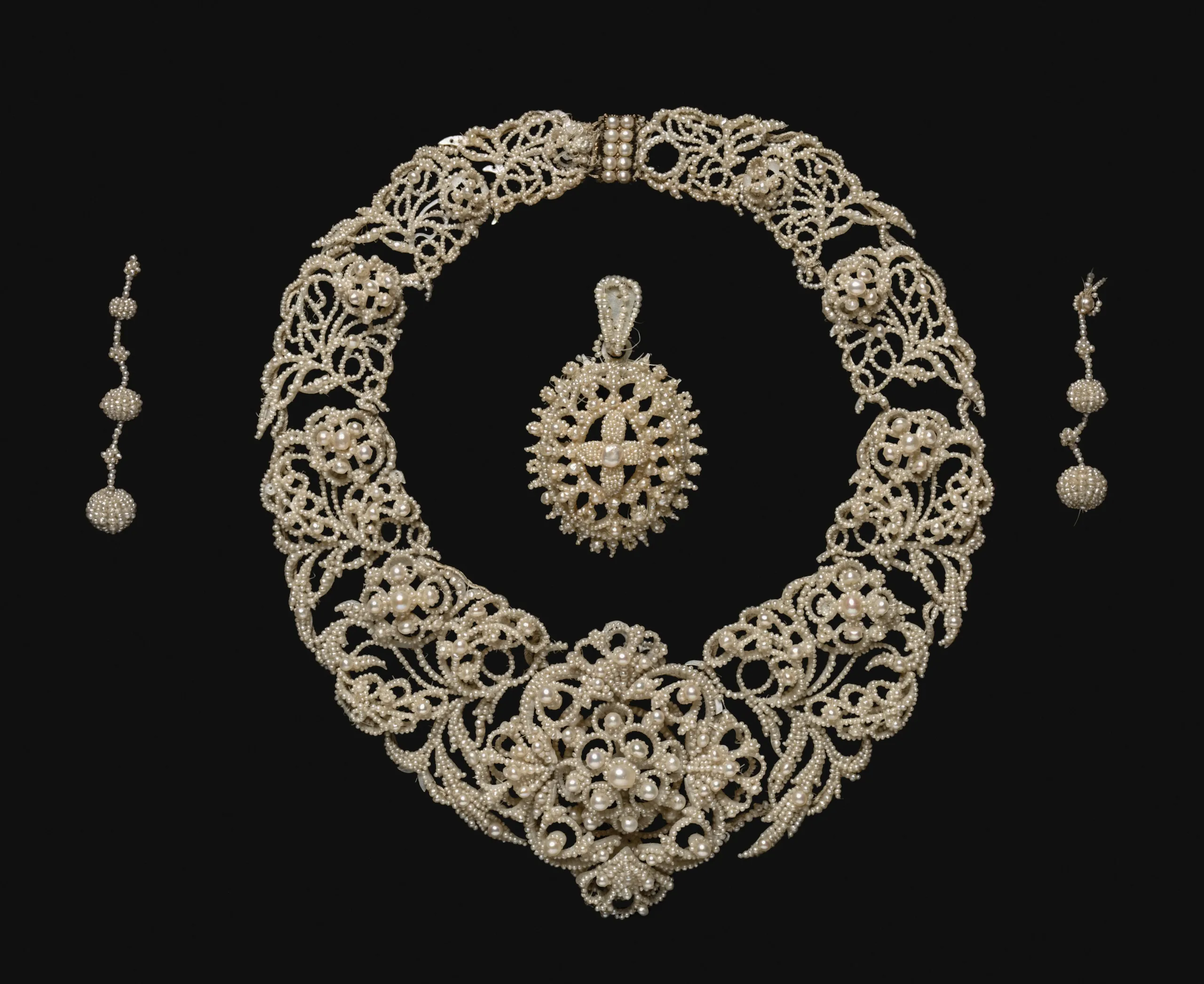 Antique Victorian fine jewelry set featuring ornate gold detailing and gemstones, available through Messina & Park estate services in New Jersey